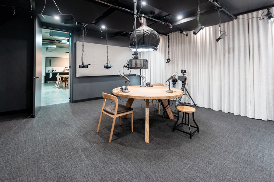 Meeting table and curtained wall in a workplace fitout