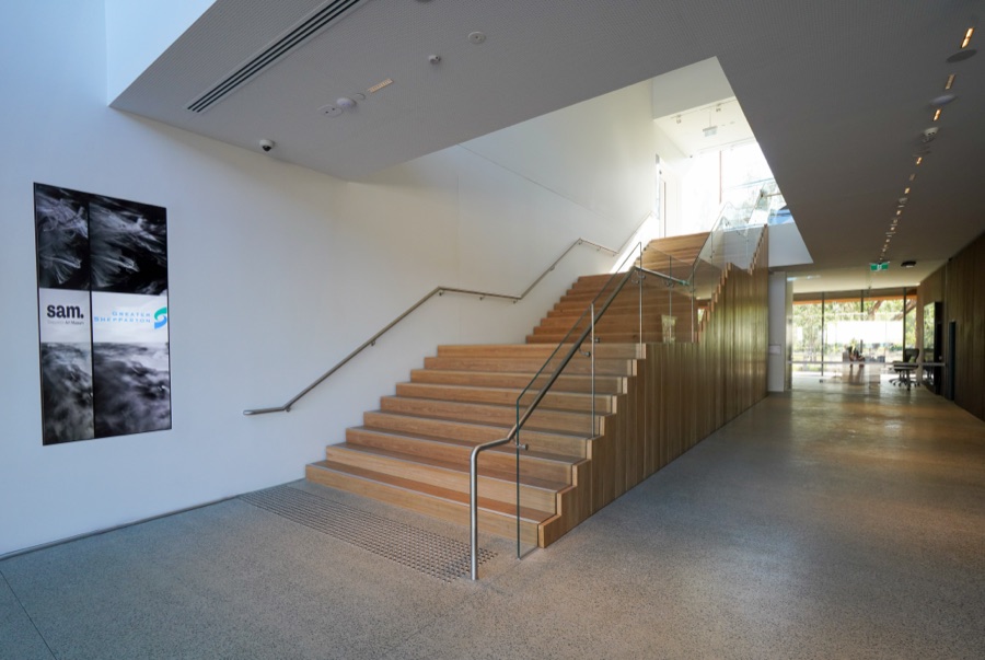 Open atrium and stair in a white gallery space