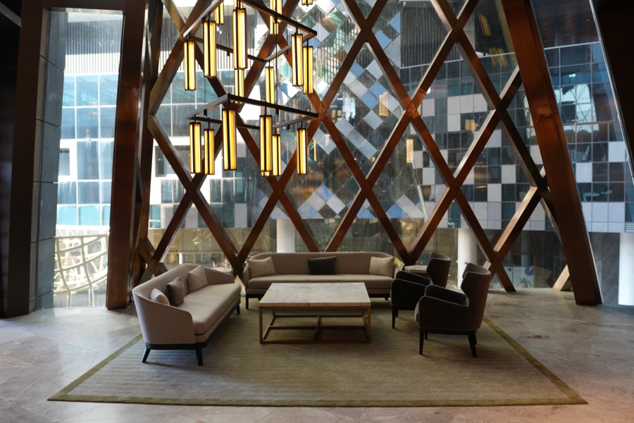 Lounge seating beneath a timber lattice ceiling