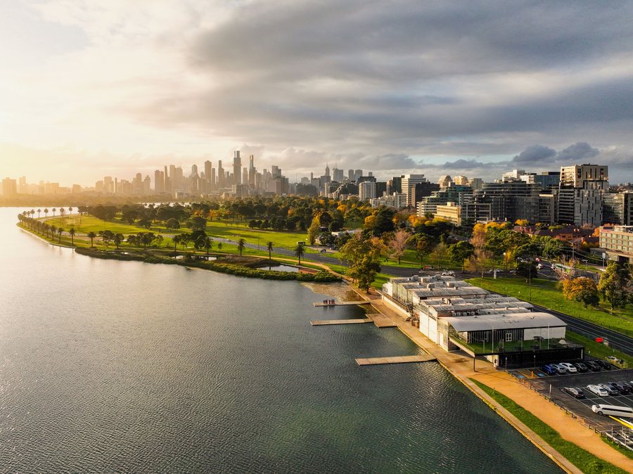 Aerial view of the Yarra, a golf course and the Melbourne skyline beyond