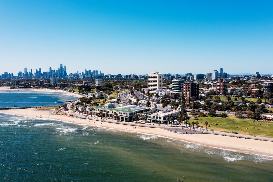 Aerial view along St Kilda beach with the Melbourne skyline behind