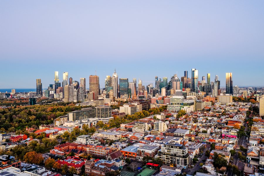 Melbourne CBD skyline photographed from above the inner northern suburbs at sunrise