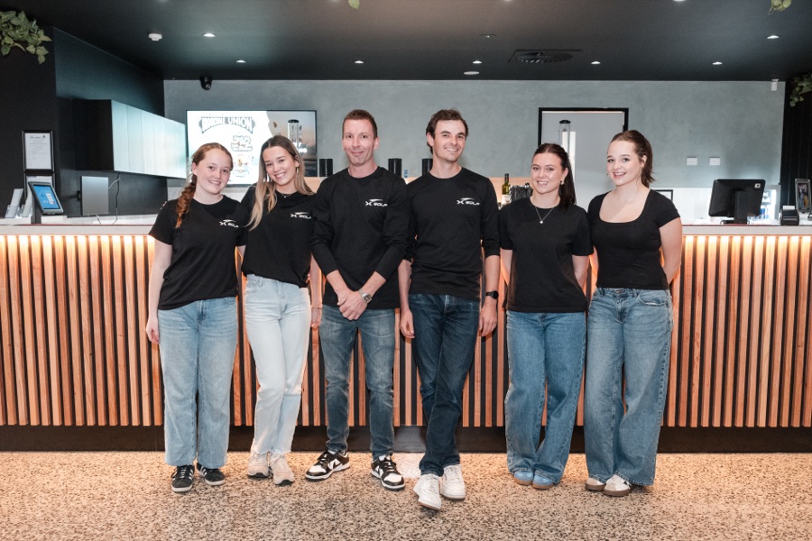 Team in branded tees at a venue launch