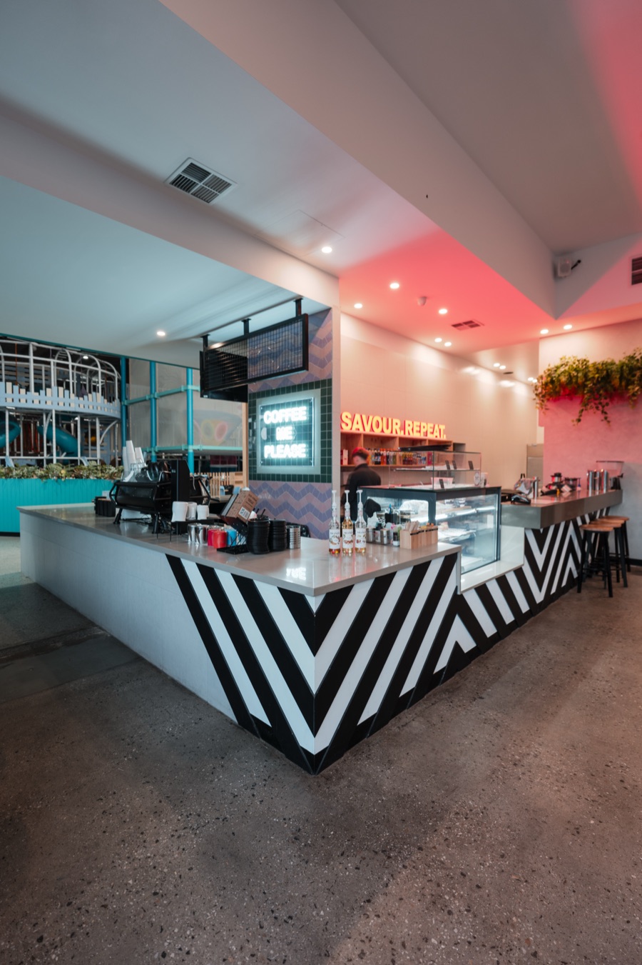The Social Fair cafe counter under the neon, before opening
