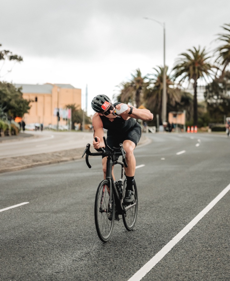 Cyclist riding a closed road in race kit