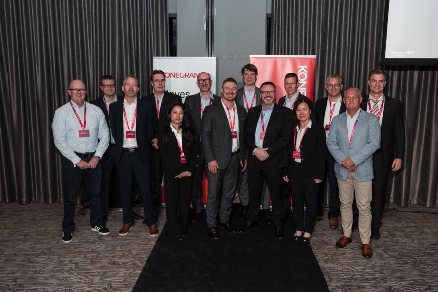 The Konecranes team photographed together on stage