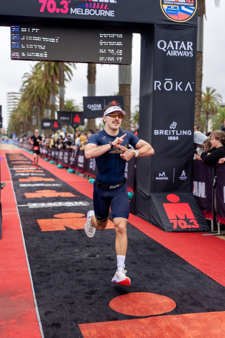 Runner on the red carpet at the Ironman 70.3 Melbourne finish