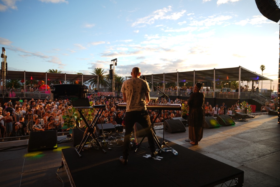 Outdoor stage and crowd at a daytime festival