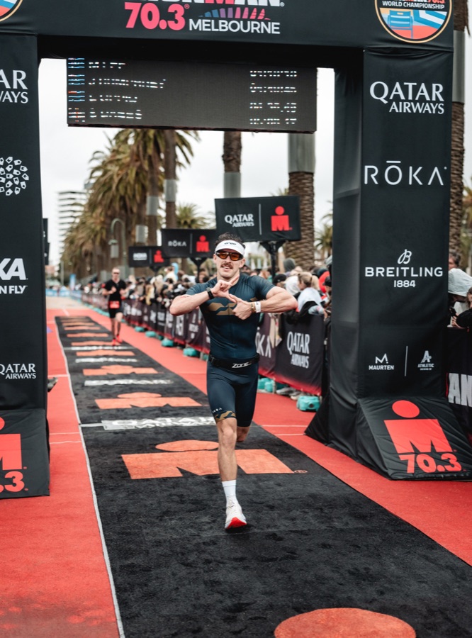 Runner approaching the finish arch at Ironman 70.3 Melbourne