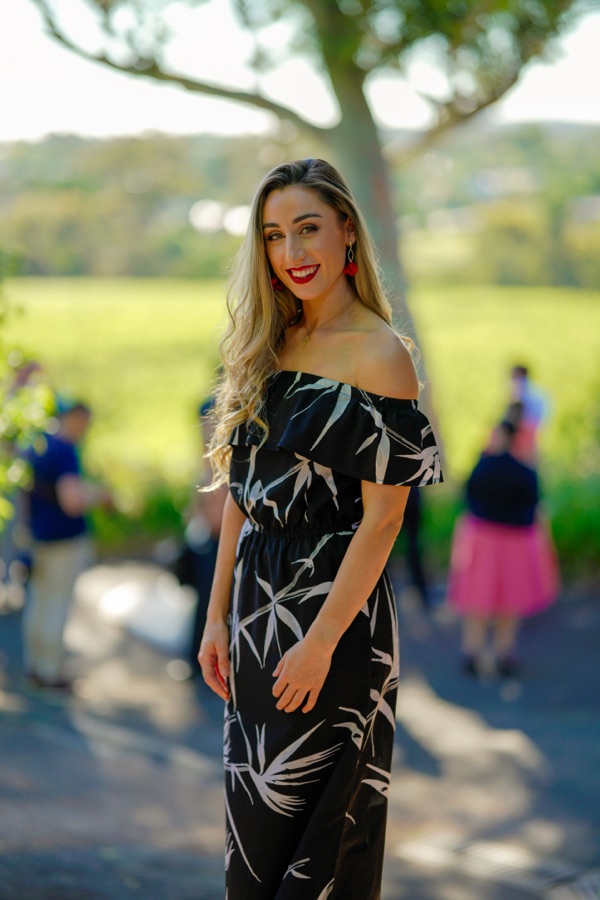 Portrait of a woman in a patterned dress on a lawn