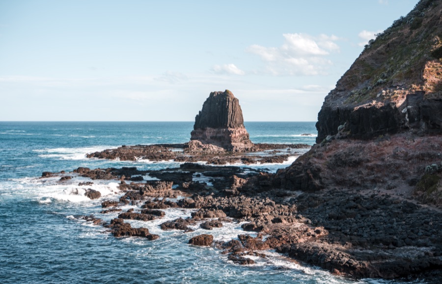 Sea stack and rock shelf on an exposed coastline
