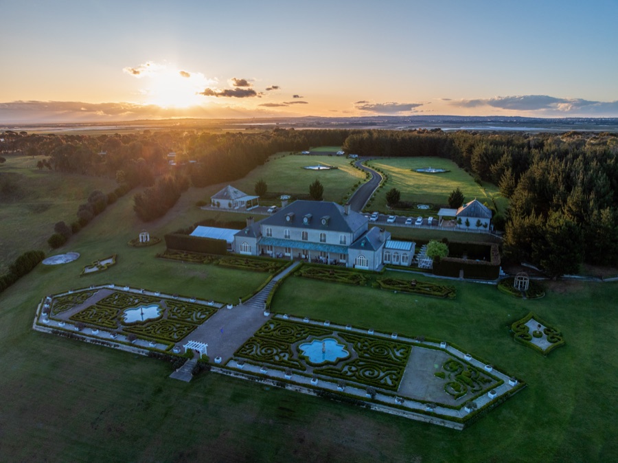 Aerial of an estate and its grounds at sunrise