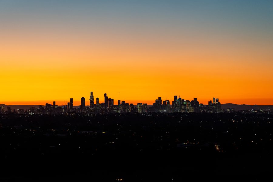Melbourne city skyline at sunset, seen from the air